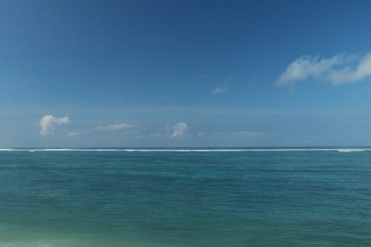 Blue sea and sky with white clouds. Holiday concept.