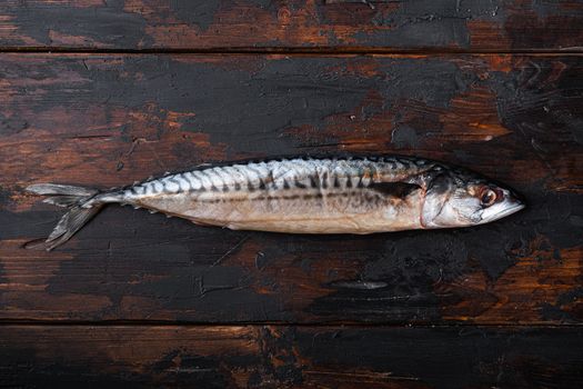 Fresh raw fish on wooden table, top view with copy space.