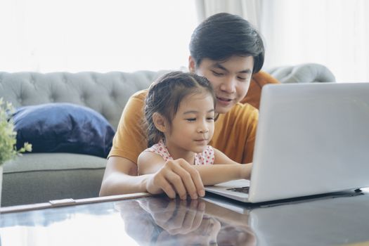 Young man and school-girl working form home, telework and e-learning