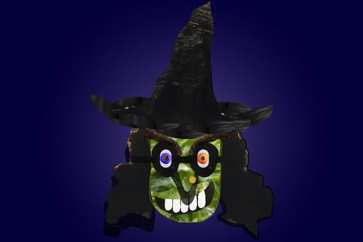 Funny and creepy Halloween witch, created with the photo collage technique, can be cut out with the vector stroke included in the image.