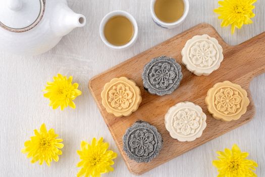Colorful beautiful moon cake, mung bean cake, Champion Scholar Pastry cake for Mid-Autumn festival traditional gourmet dessert snack, top view, flat lay.