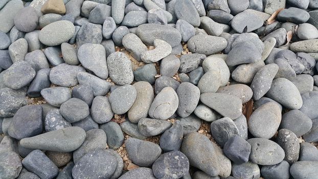 Texture background: Rock Pebbles, small, rounded, smooth pibbles with copy space for text