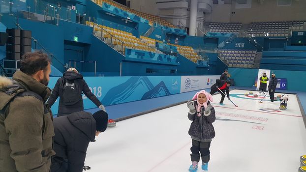 Pyeongchang, South Korea - Fbruary 09, 2019: People play in curling for recreation purpose, in ice arena during winter season.