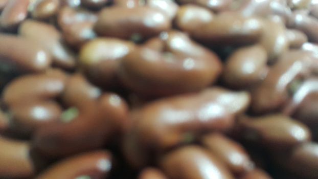 Kidenry beans:   Closeup view of uncooked red kidney beans. Dark red useful beans background.