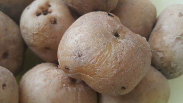  close up view of fresh organic potato in market:  Food background texture of raw potatoes