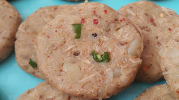Spicy and tasty uncooked kebab stuffed with minced meat, onion,  alo paste and chana. Asian spicy cuisine.