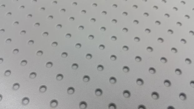 Grey plastic woven stripes of traditional bed, chair or sitting stool used in rural areas.
