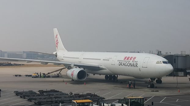 Beijing Airport, china- April 2019: Passenger plane standing in airport on the concrete paved runway terminal for loading, boarding and maintenance before take off for predestined flights.
