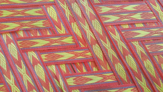 Colorful plastic woven stripes of traditional bed used in rural areas.