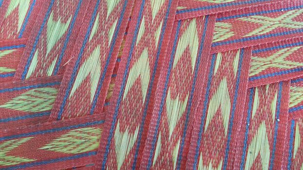 Colorful plastic woven stripes of traditional bed used in rural areas.