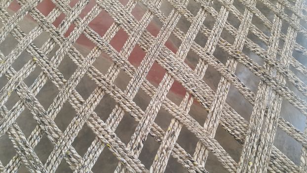 Closeup view of dried jute thread or ropes interwoven for making traditional old style bed called charpai