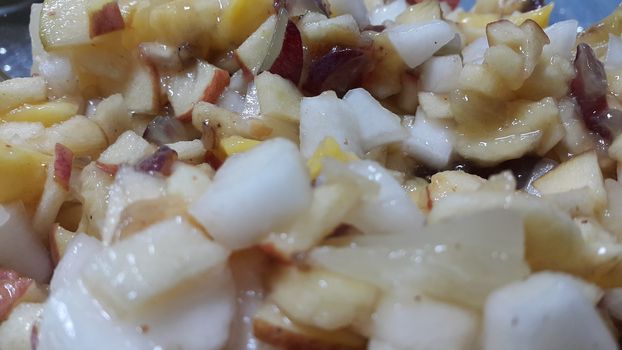Closeup view of fresh tasty and spicy homemade fruit chaat dish. Chaat is traditional dish in South Asian countries
