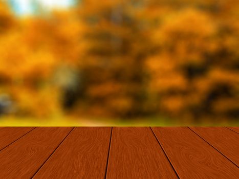 Empty wooden table with blurred autumn forest in the background.