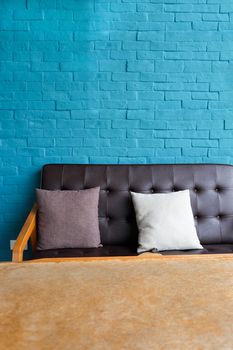 Detail of Living room with Leather sofa on blue brick wall Background