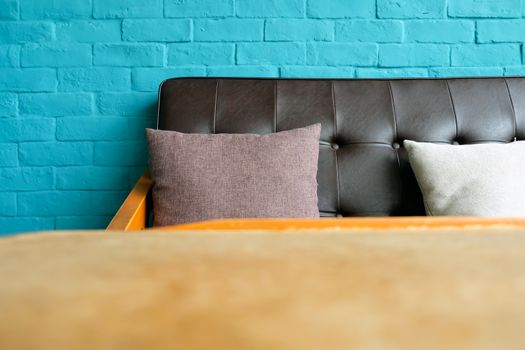 Detail of Living room with Leather sofa on blue brick wall Background