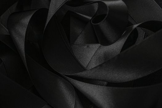 Black silk ribbon as background, abstract and luxury brand designs