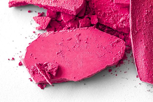 Pink eye shadow powder as makeup palette closeup isolated on white background, crushed cosmetics and beauty textures