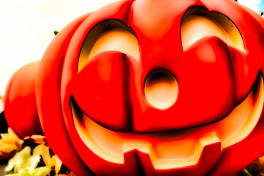 Halloween decorations concept.Close up of Jack O'lantern, vintage lanterns, pumpkins, skull, autumn leaves. Colorful Halloween. Happy Halloween scene background