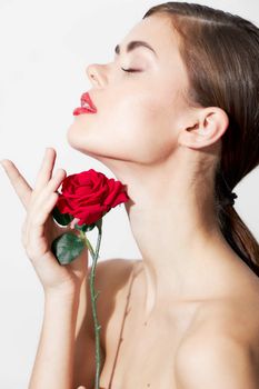 Girl with bare shoulders Eyes closed rose charm attractive look background