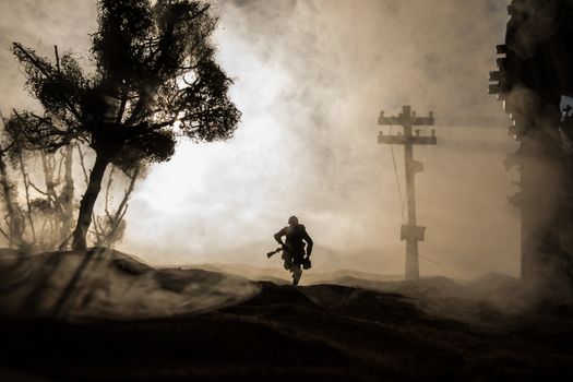 War Concept. Military silhouettes fighting scene on war fog sky background, World War Soldiers Silhouette Below Cloudy Skyline sunset. Selective focus