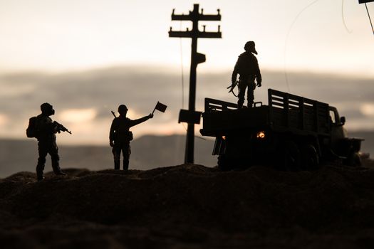 War Concept. Military silhouettes fighting scene on war fog sky background, World War Soldiers Silhouette Below Cloudy Skyline sunset. Selective focus