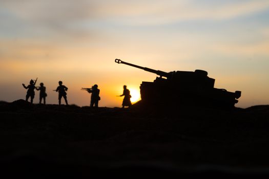 War Concept. Military silhouettes fighting scene on war fog sky background, World War Soldiers Silhouette Below Cloudy Skyline sunset. Selective focus