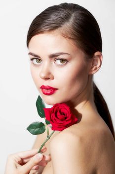 Brunette with a rose Red lips charm makeup close-up