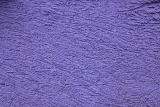 Lilac background with decorative relief . Lilac wall background.