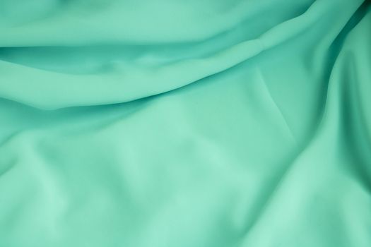 Turquoise fabric texture background, crumpled fabric background.