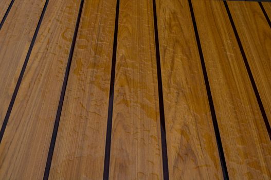 Drops of water on wooden bench after the rain, natural weather background.