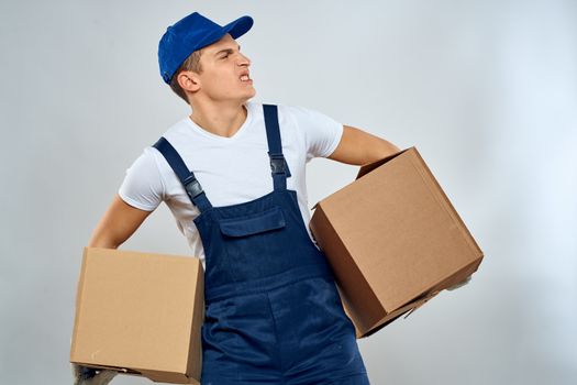 Man worker with box in hands delivery loading service packing service. High quality photo