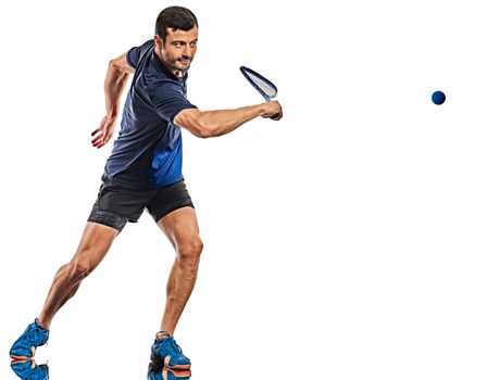 one caucasian mature man practicing squash player in studio isolated on white background