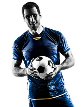 one caucasian soccer player man standing smiling in silhouette isolated on white background