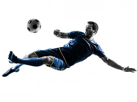 one caucasian soccer player man playing kicking in silhouette isolated on white background