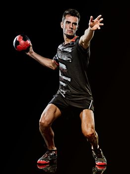 one caucasian young handball player man in studio isolated on black background