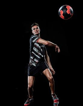 one caucasian young handball player man in studio isolated on black background