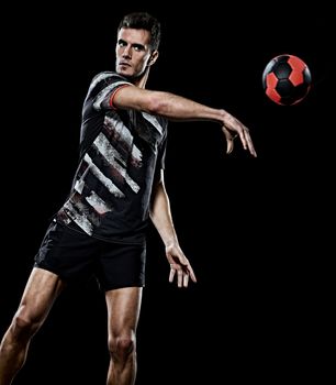 one caucasian young handball player man in studio isolated on black background