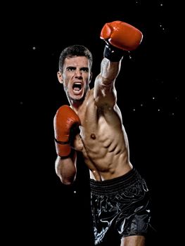 one caucasian young player man boxer boxing portrait waist up in studio isolated on black background