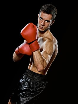 one caucasian young player man boxer boxing portrait waist up in studio isolated on black background