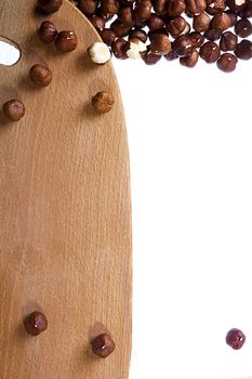 Cutting board and nuts on white background