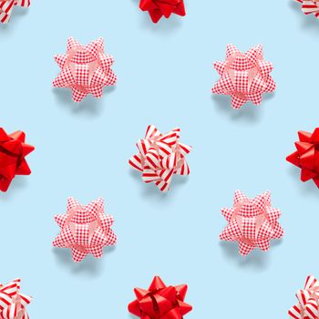 Seamless regular creative Christmas pattern with New Year decorations on blue background. xmas Modern Seamless pattern made from christmas decorations. Photo quality pattern for fabric, prints, wallpapers, banners or creative design works.