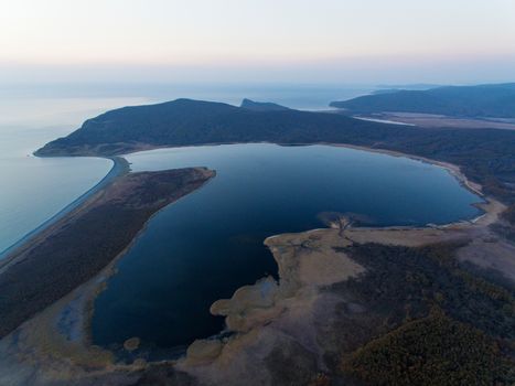 Beautiful lake Blagodatnoe in the form of a heart. Lake in the Sikhote-Alin Biosphere Reserve