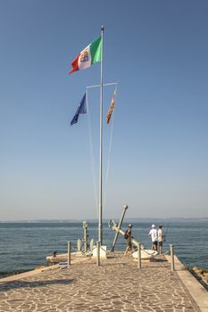 BARDOLINO, ITALY 16 SEPTEMBER 2020: Bardolino Pier on Grada Lake in Italy during summer