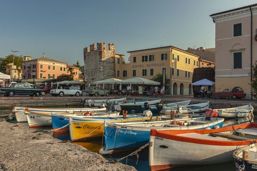 BARDOLINO, ITALY 16 SEPTEMBER 2020: Port on Garda Lake of Bardolino with colored boats