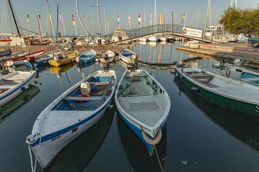 BARDOLINO, ITALY 16 SEPTEMBER 2020: Port on Garda Lake of Bardolino with colored boats