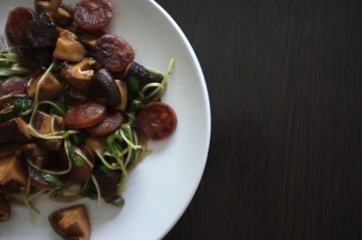 Fried Sunflower Sprout and chinese sausage with Oyster Sauce - healthy food style , space for text