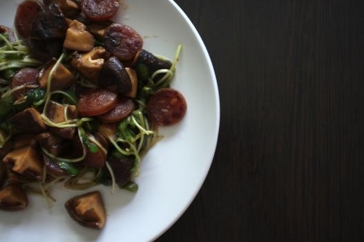 Fried Sunflower Sprout and chinese sausage with Oyster Sauce - healthy food style , space for text