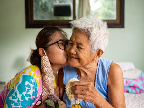 The image of the woman on the cheek grandmother. real bodies concept.