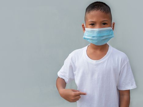 Boy wearing a protective mask On a white background. New normal concept.