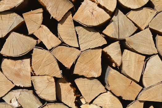 Pile of split logs detail background